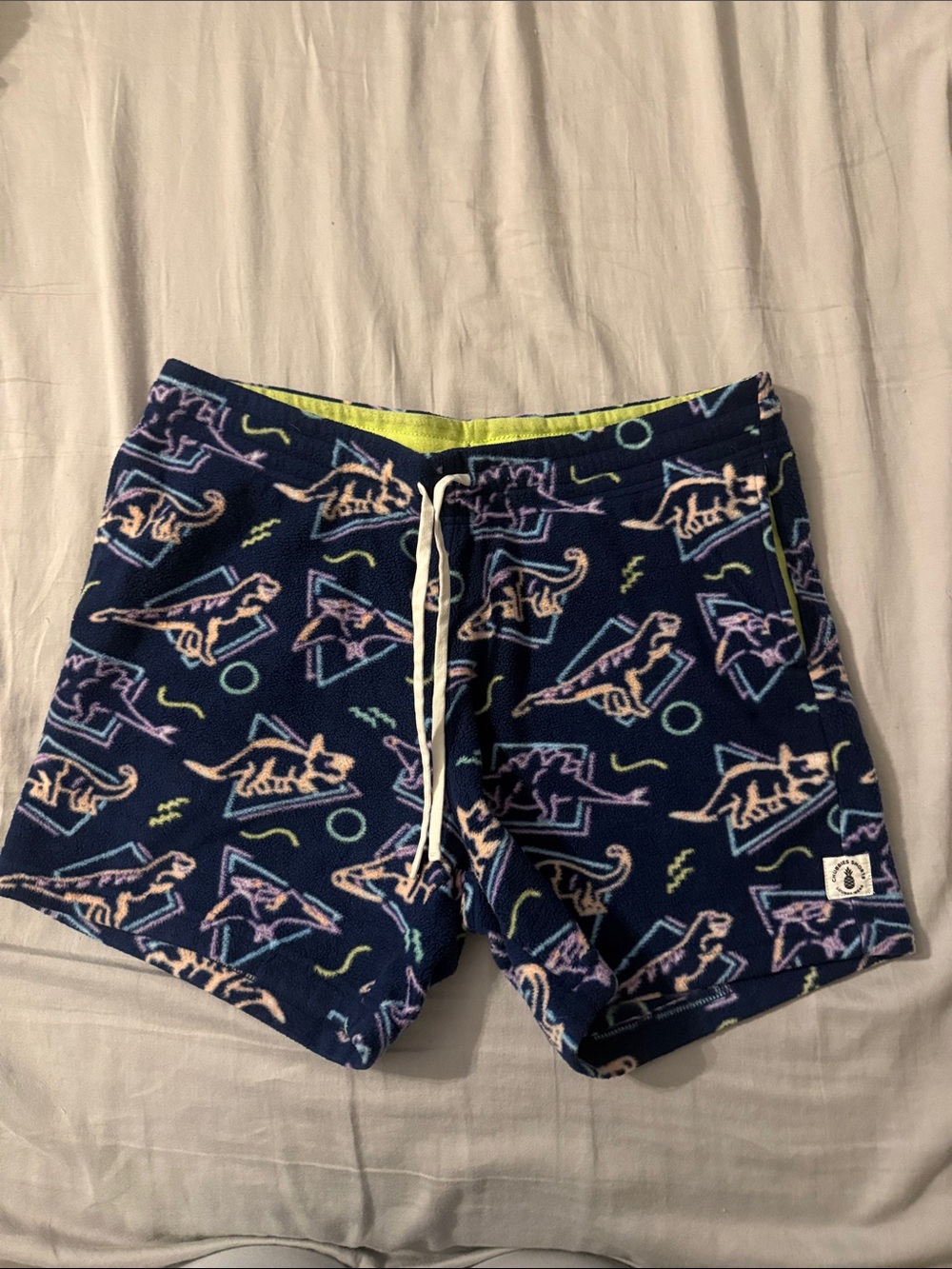 chubbies Navy Shorts with Pastel Dino Print and Neon Lime Lining